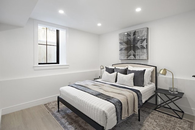 bedroom with wood-type flooring