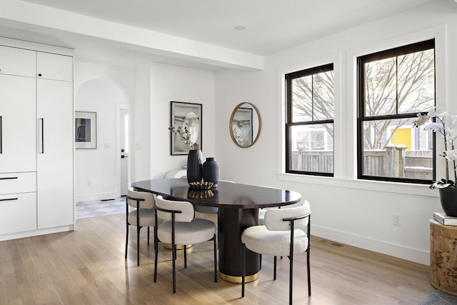 dining area featuring light wood-type flooring