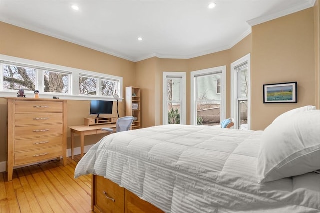 bedroom with crown molding and light hardwood / wood-style flooring