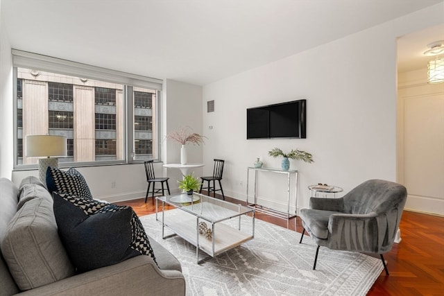 living room featuring parquet floors