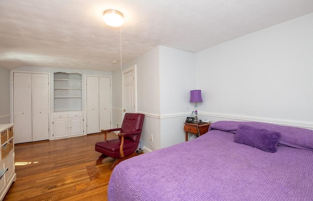 bedroom featuring wood finished floors