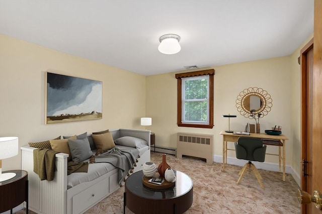 living room featuring radiator heating unit, a baseboard heating unit, and a desk