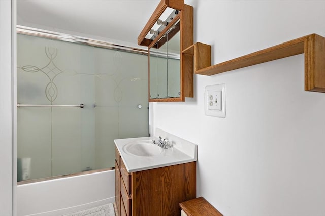 bathroom with vanity and enclosed tub / shower combo