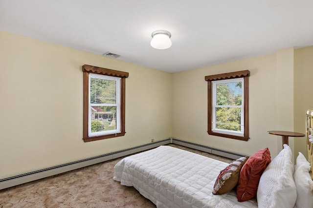 carpeted bedroom with multiple windows