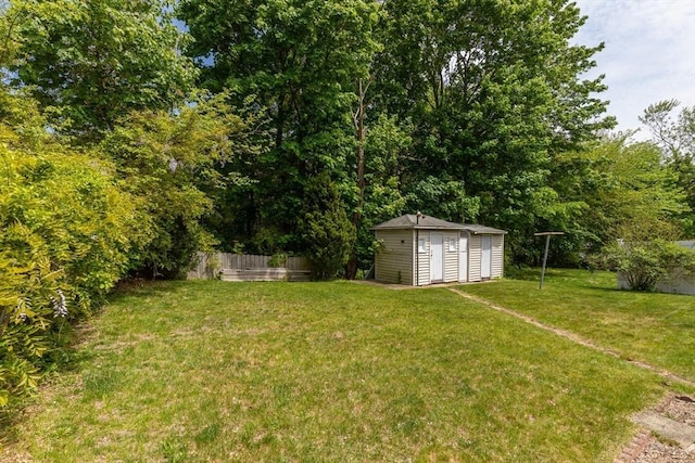 view of yard with a shed and an outbuilding