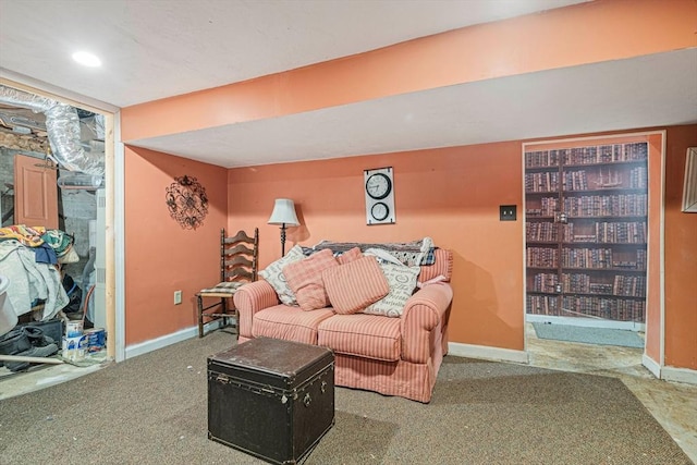 carpeted living room with baseboards