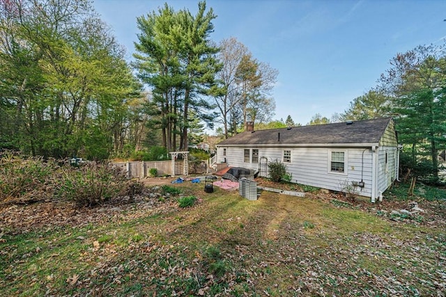 back of property featuring a chimney