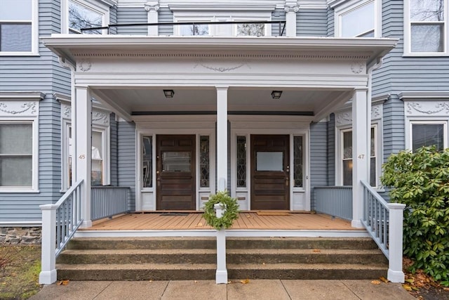 doorway to property featuring covered porch