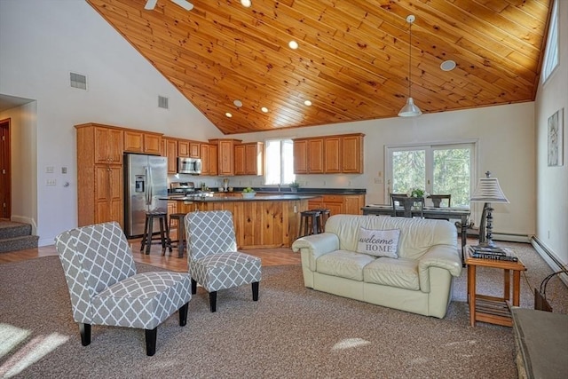 living room with wood ceiling and high vaulted ceiling