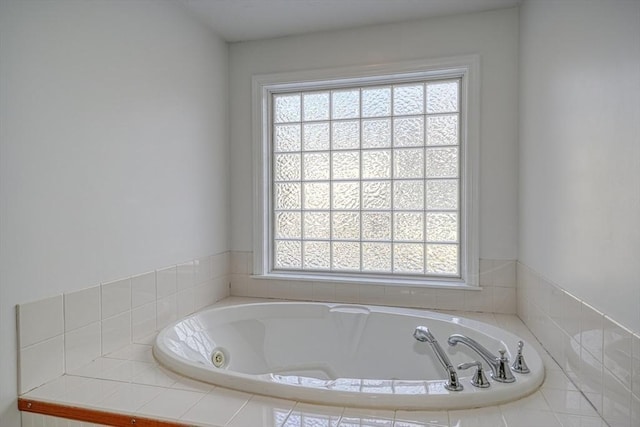 bathroom with tiled bath