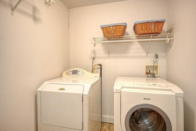 washroom featuring washer and clothes dryer