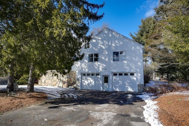 view of home's exterior with a garage