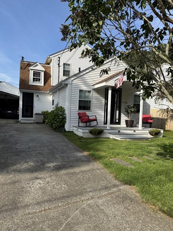 7 Grove St, Fairhaven, MA 02719 - view of front of house featuring a front yard, covered porch, and driveway