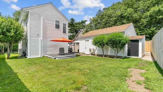 7 Grove St, Fairhaven, MA 02719 - back of house with a fenced backyard, a wooden deck, and a shed