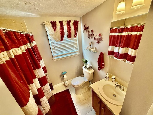 bathroom with a textured ceiling, tile patterned flooring, curtained shower, toilet, and vanity
