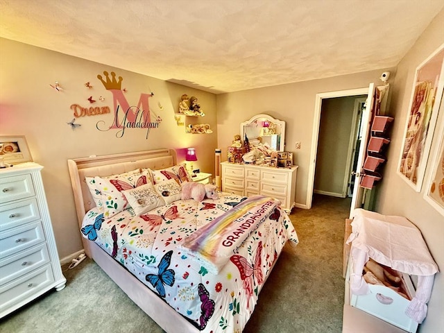 carpeted bedroom featuring baseboards