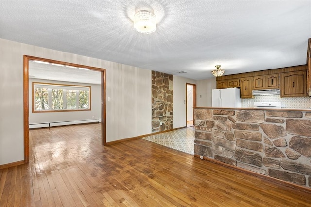 97 Marshall St, Revere, MA 02151 - unfurnished living room with a baseboard radiator, wood-type flooring, and a textured ceiling