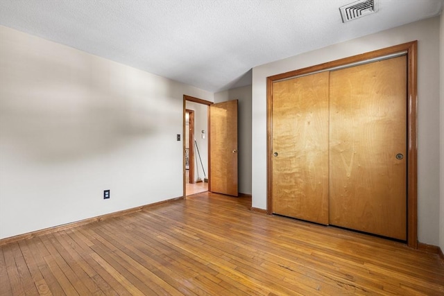 97 Marshall St, Revere, MA 02151 - unfurnished bedroom featuring light wood finished floors and a closet