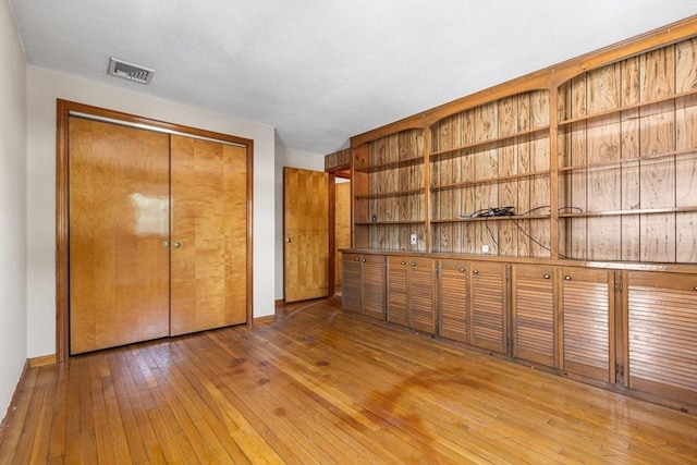 97 Marshall St, Revere, MA 02151 - unfurnished bedroom featuring hardwood / wood-style floors and a closet