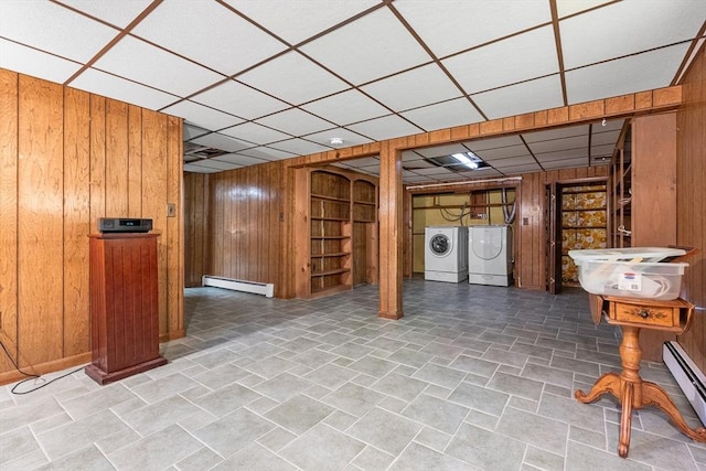 97 Marshall St, Revere, MA 02151 - finished below grade area featuring wooden walls, a paneled ceiling, baseboard heating, and washing machine and clothes dryer