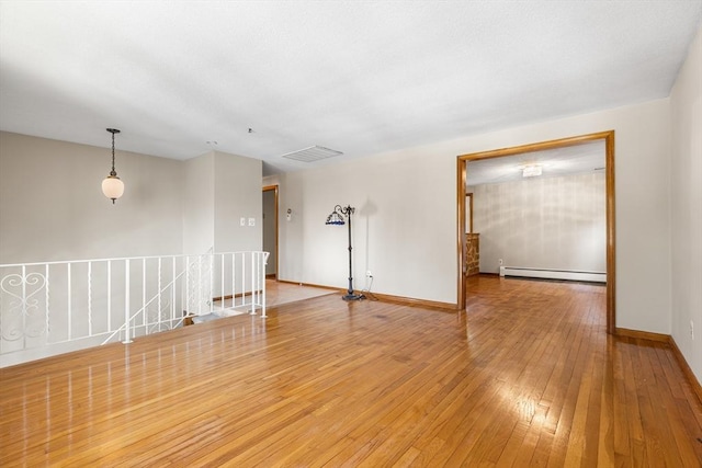 97 Marshall St, Revere, MA 02151 - unfurnished room with a baseboard radiator and light wood finished floors