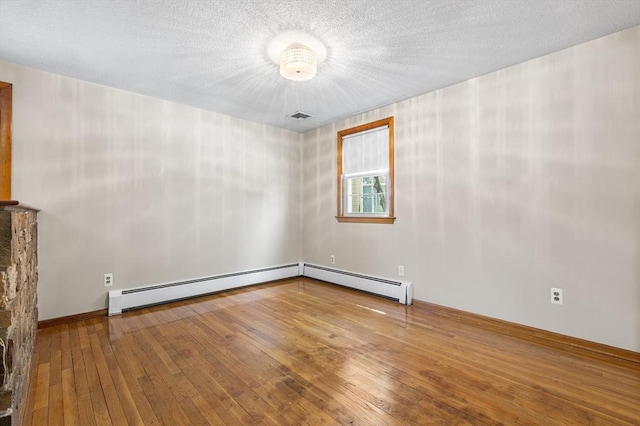97 Marshall St, Revere, MA 02151 - spare room with hardwood / wood-style floors and a baseboard radiator