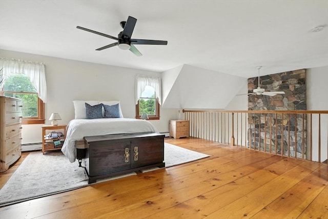 114 Center St, Carver, MA 02330 - bedroom featuring hardwood / wood-style flooring, a baseboard radiator, lofted ceiling, and a ceiling fan