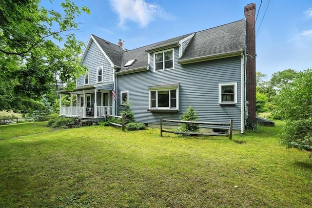 114 Center St, Carver, MA 02330 - rear view of house with covered porch, a chimney, a yard, and roof with shingles
