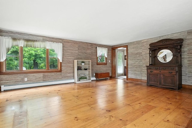 114 Center St, Carver, MA 02330 - unfurnished living room featuring a baseboard heating unit and hardwood / wood-style flooring