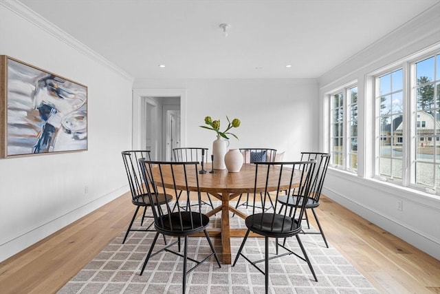 dining space with recessed lighting, baseboards, light wood-style floors, and ornamental molding