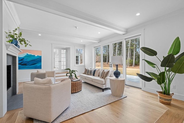 living room with wood finished floors, baseboards, beam ceiling, french doors, and crown molding