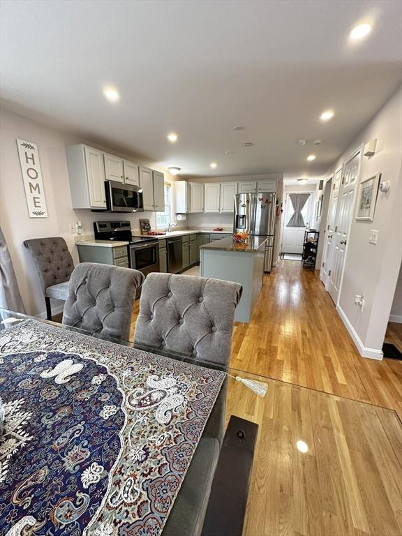 121 Camp St Unit 108, Yarmouth, MA 02673 - living room with light wood finished floors, recessed lighting, and baseboards