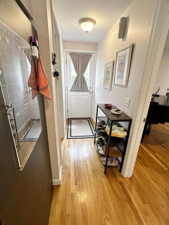 121 Camp St Unit 108, Yarmouth, MA 02673 - doorway to outside with light wood-style floors and baseboards