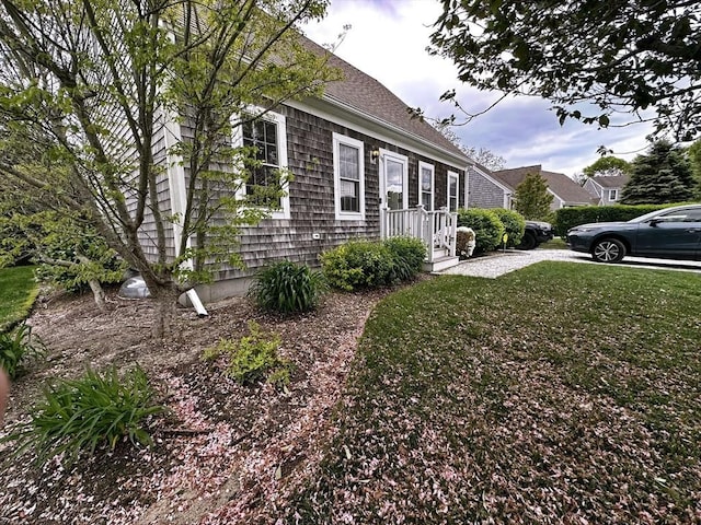 121 Camp St Unit 108, Yarmouth, MA 02673 - view of home's exterior with a yard
