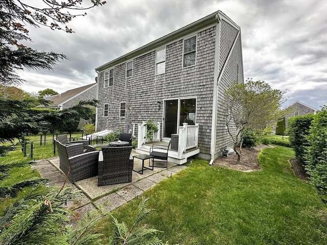 121 Camp St Unit 108, Yarmouth, MA 02673 - rear view of property with a patio