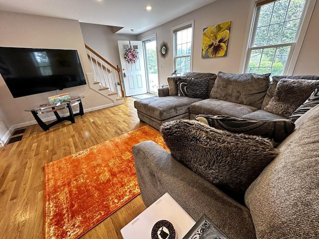 121 Camp St Unit 108, Yarmouth, MA 02673 - living room with stairway, wood finished floors, baseboards, and recessed lighting