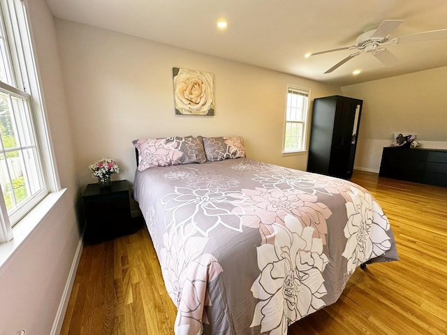 121 Camp St Unit 108, Yarmouth, MA 02673 - bedroom with multiple windows, wood finished floors, baseboards, and recessed lighting