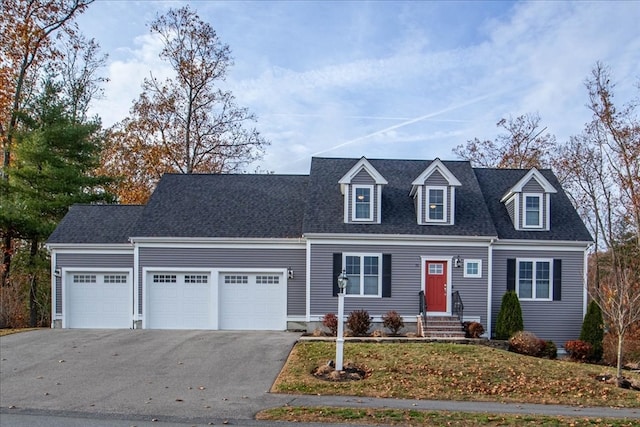 cape cod house featuring a garage