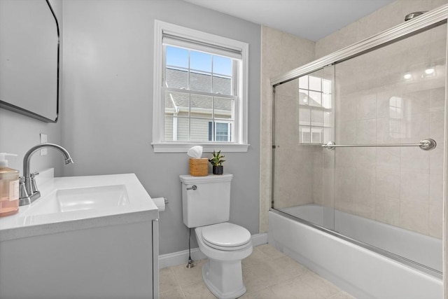 full bathroom with vanity, shower / bath combination with glass door, tile patterned floors, and toilet