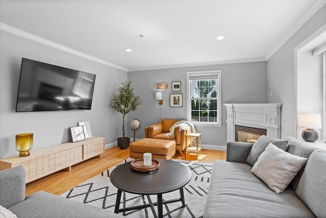 living room featuring light hardwood / wood-style flooring and crown molding