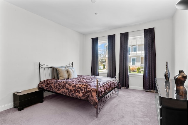 bedroom with light carpet