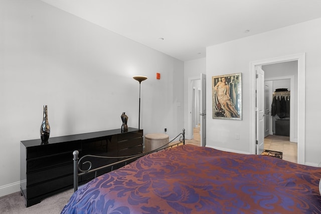 bedroom featuring light colored carpet