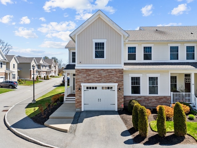 view of front of home with a porch and a garage