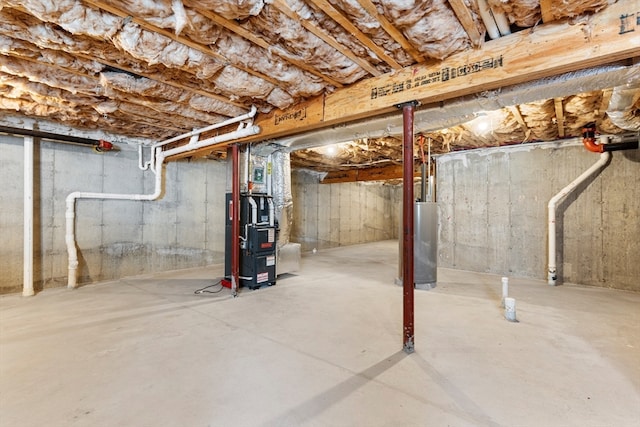 basement with gas water heater and heating unit