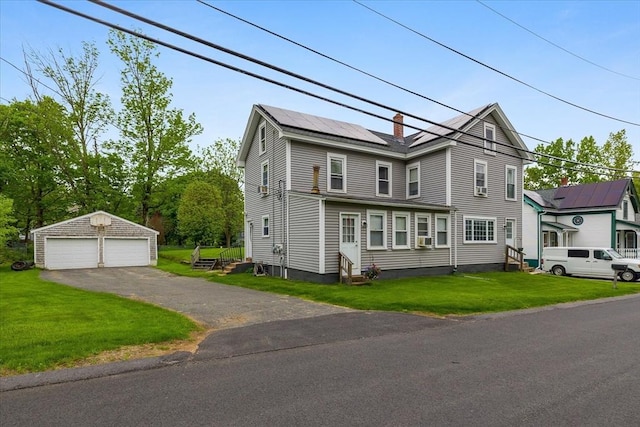 9 Green St, Brookfield, MA 01506 - view of front facade featuring an outdoor structure, entry steps, a garage, a front yard, and solar panels