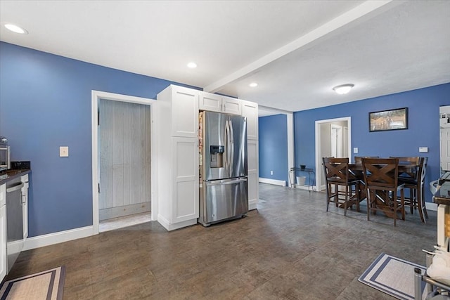 9 Green St, Brookfield, MA 01506 - kitchen with stainless steel fridge with ice dispenser, white cabinetry, baseboards, recessed lighting, and beam ceiling