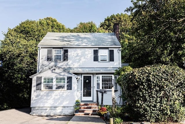 1 Gwinnett St, Boston, MA 02136 - view of front of home with a chimney and entry steps