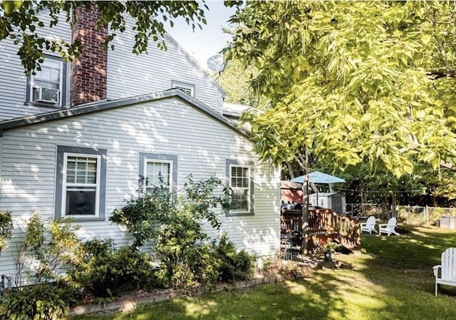 1 Gwinnett St, Boston, MA 02136 - view of side of home featuring a yard and a deck