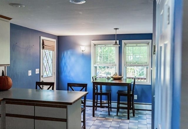 1 Gwinnett St, Boston, MA 02136 - dining area featuring a baseboard heating unit and light flooring