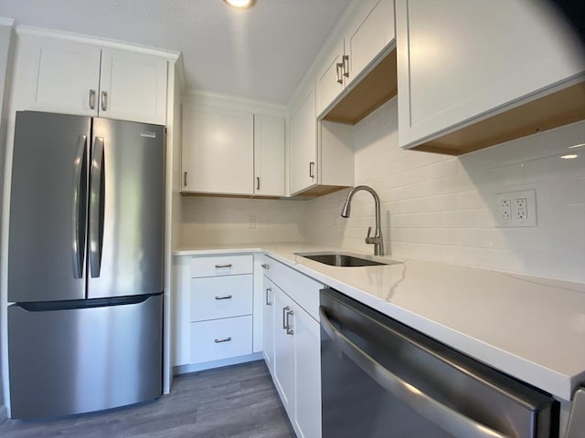 270 Sunderland Rd Unit 11, Worcester, MA 01604 - kitchen with stainless steel appliances, a sink, tasteful backsplash, white cabinets, and dark wood-type flooring